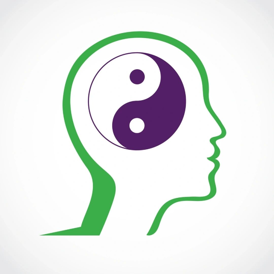 A green and purple drawing of a person 's head with an image of yin yang in the middle.